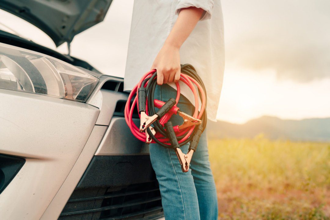 Woman Holding Jump Start Cables